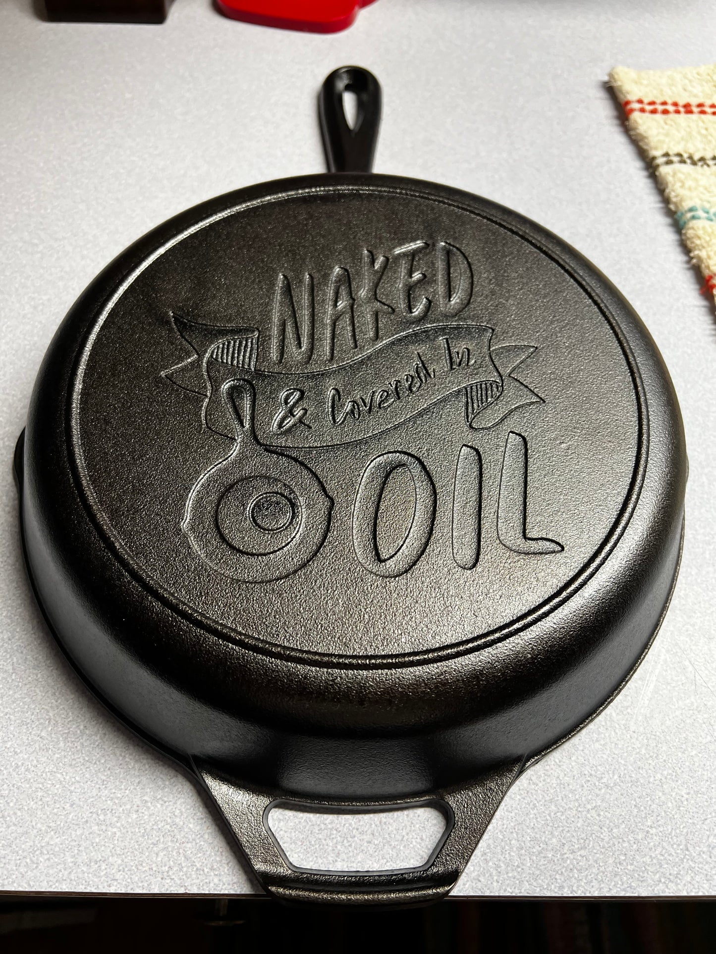 Naked, covered in oil skillet